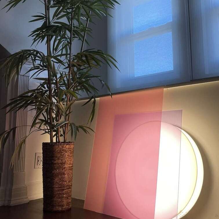pink and purple modern floor lamp lean aganist wall