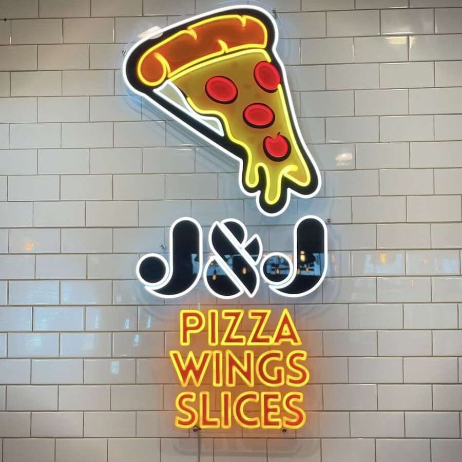 pizza wings slices restaurant neon sign in crooked run fermentation in Washington