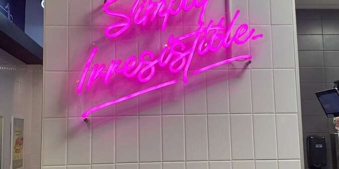 simply irresistable restaurant neon sign in Cracked Eggery