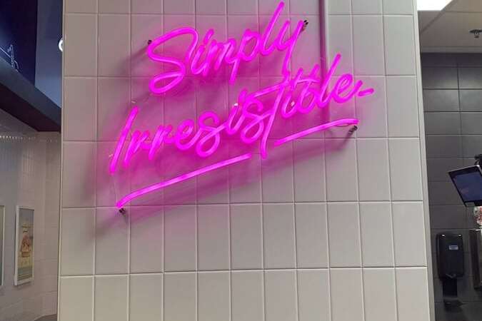 simply irresistable restaurant neon sign in Cracked Eggery