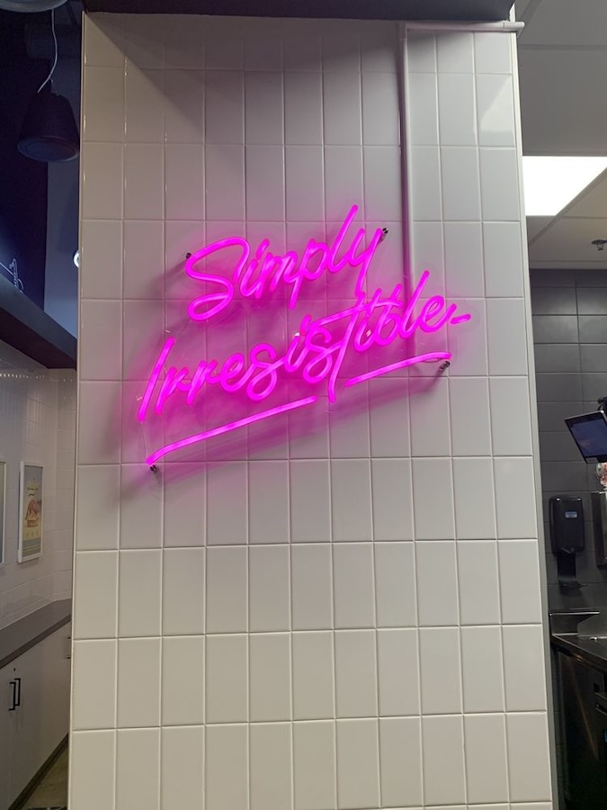 simply irresistable restaurant neon sign in Cracked Eggery