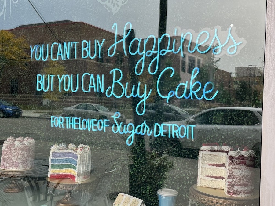 you can't buy happiness but you can buy cake bakery neon sign