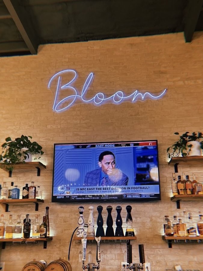Bloom restaurant and bar neon sign