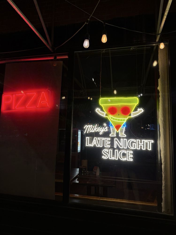 Mikey’s Late Night Slice pizza restaurant neon signs in Columbus