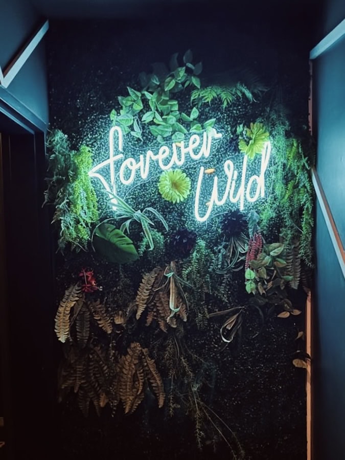 Wild Rose Eatery and Bar forever wild white neon sign