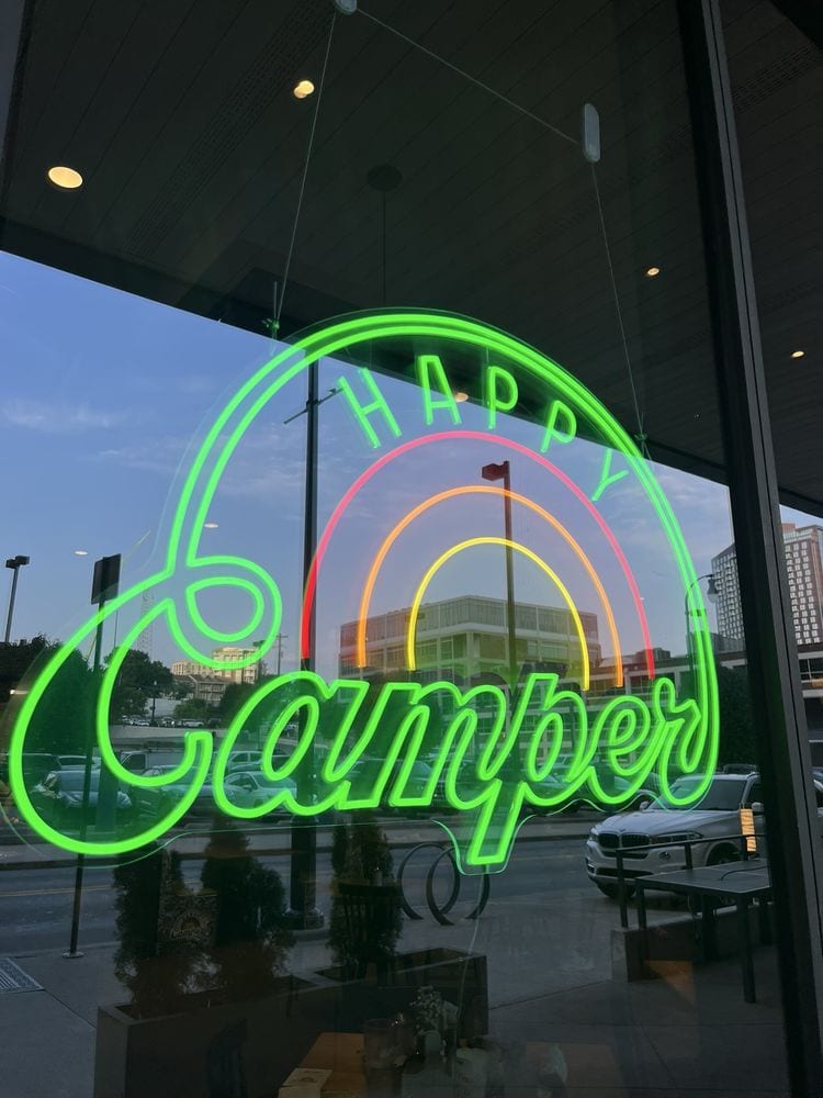 happy camper caming vibe neon signs in Nashville