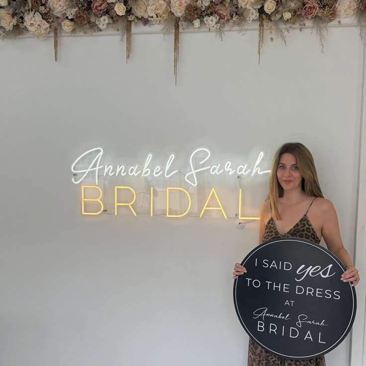 Annabel Sarah Bridal neon logo sign on a bridal boutique wall