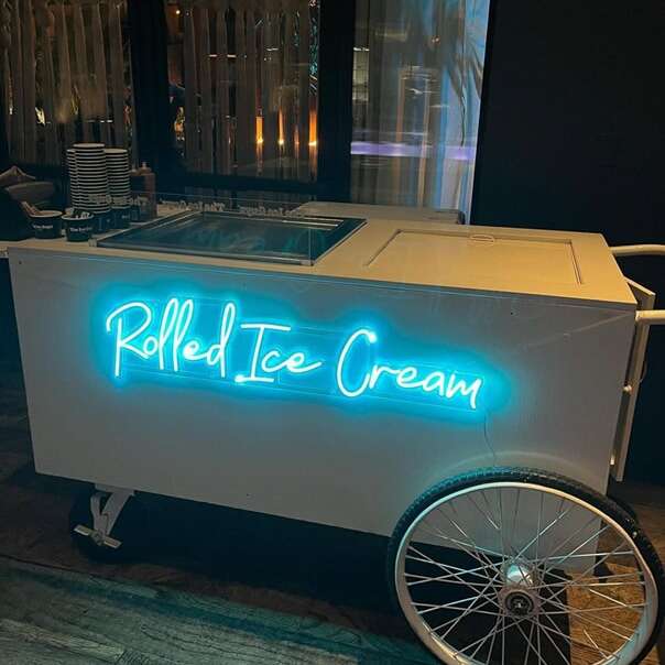 Blue Rolled Ice Cream led neon sign on a mobile ice cream cart