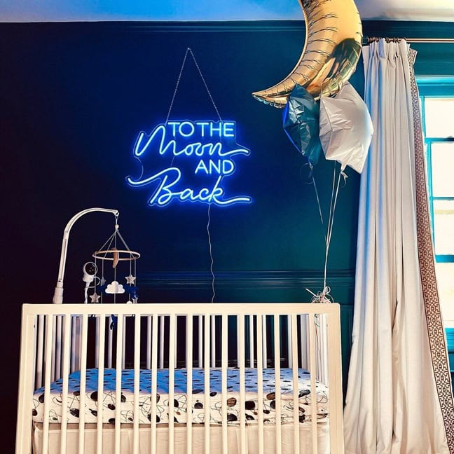 Blue moon-themed neon sign for a baby nursery