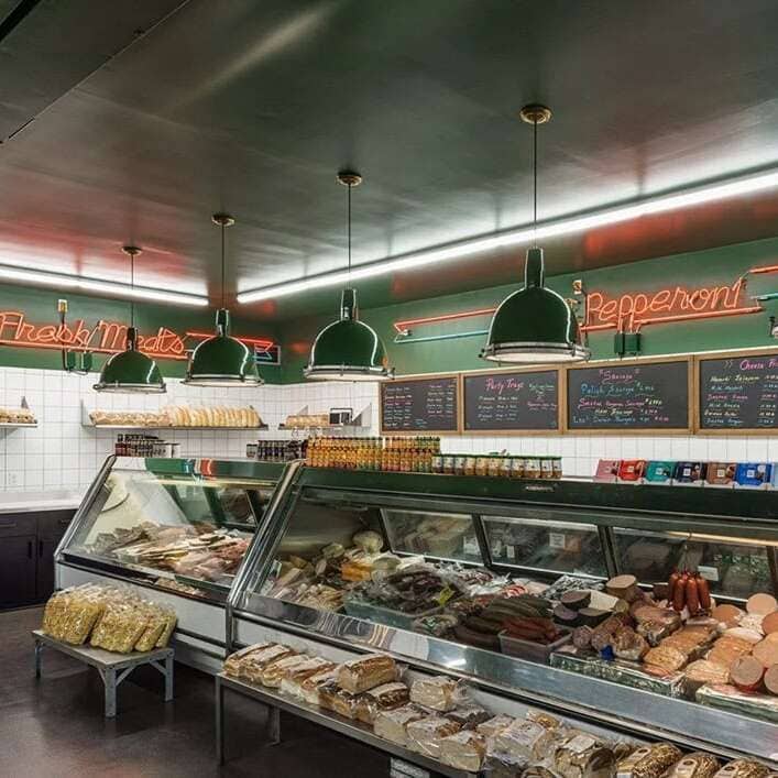 Classic orange neon signs for a deli and meat counter