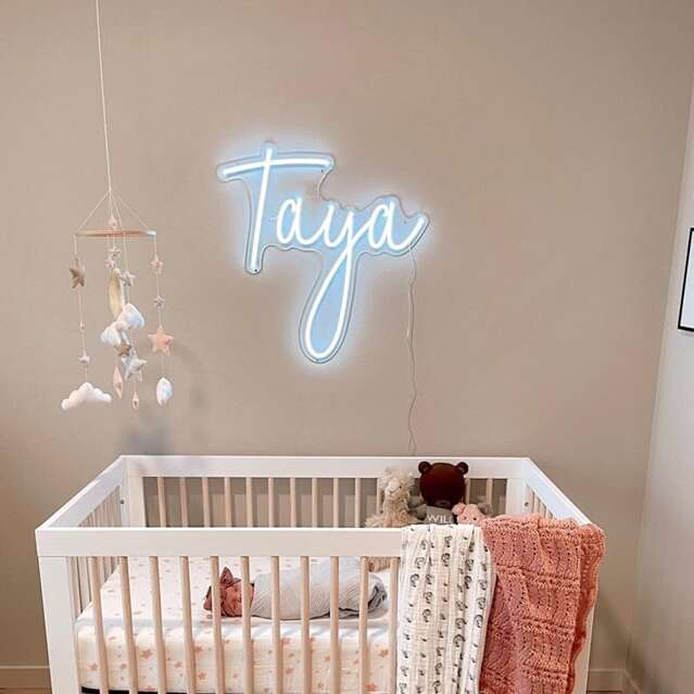 Custom baby name neon sign for a nursery in white