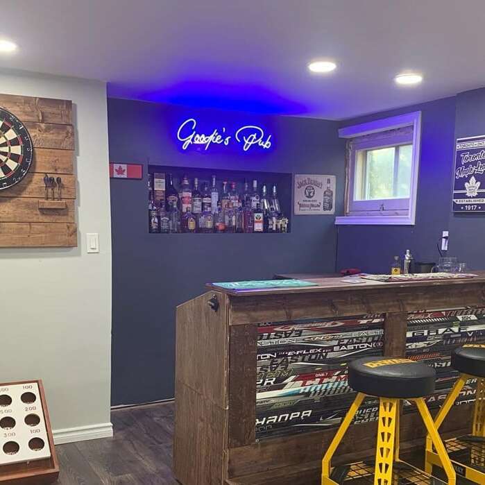 Custom blue neon sign for a basement bar