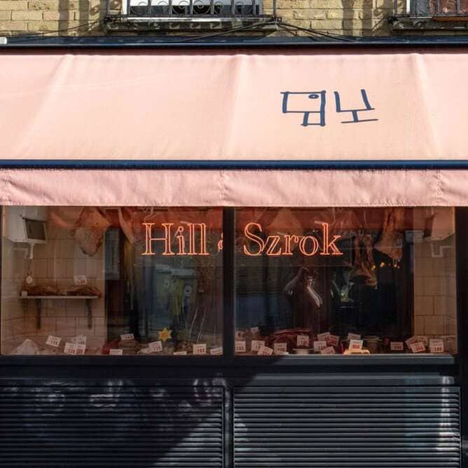 Custom butcher shop neon sign with classic storefront lettering