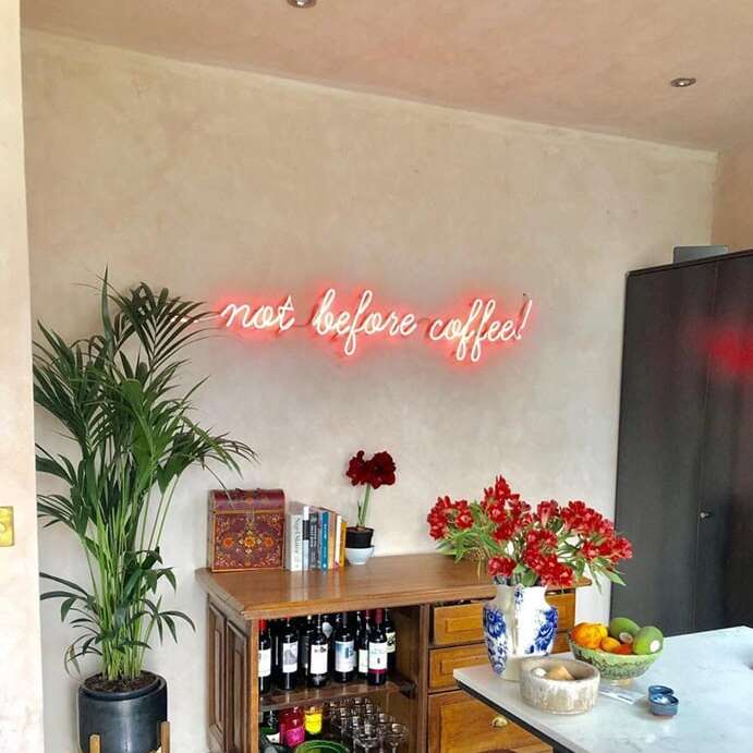 Custom coffee quote real neon sign for a kitchen in coral pink