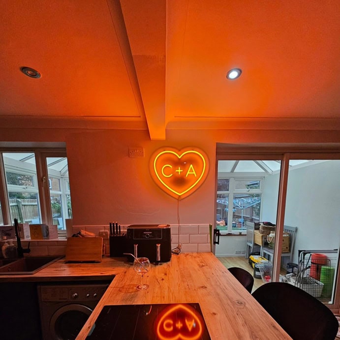 Custom heart neon sign with initials for a kitchen