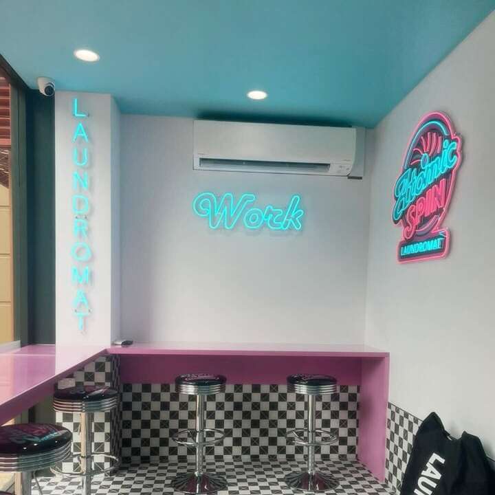 Custom laundromat led neon signs in turquoise and pink for its logo