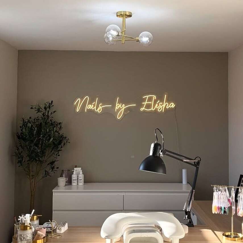 Custom nail salon neon sign with warm white lettering