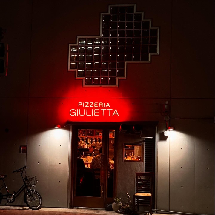 Custom red Pizzeria Giulietta true neon sign for a pizza shop storefront
