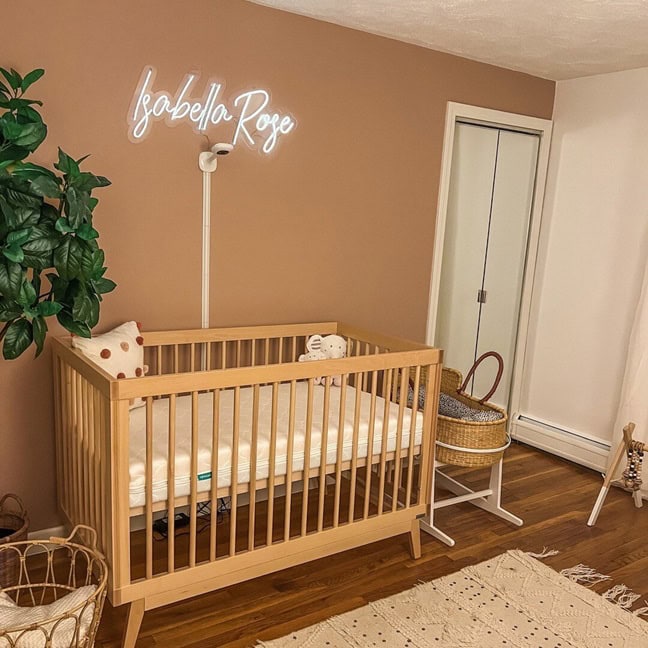 Personalized white neon sign for a nursery with neutral decor