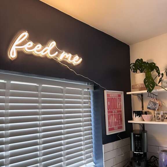 Warm white script neon sign for a cozy kitchen