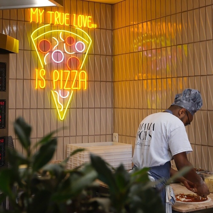 Yellow My True Love Is Pizza neon sign for a pizzeria with a pizza slice design