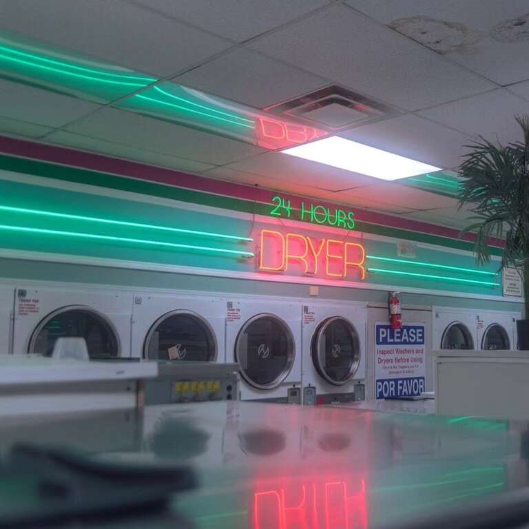 classic vintage Red dryer neon sign with green laundromat accent lighting