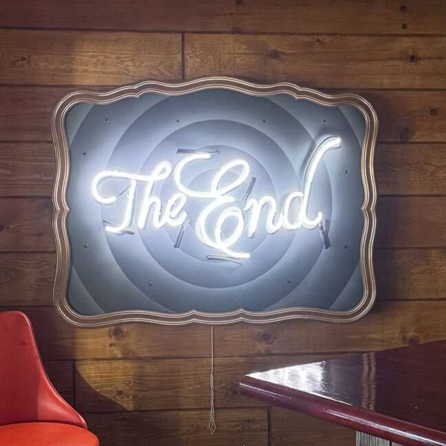 true glass white neon sign for a rec room with rustic decor